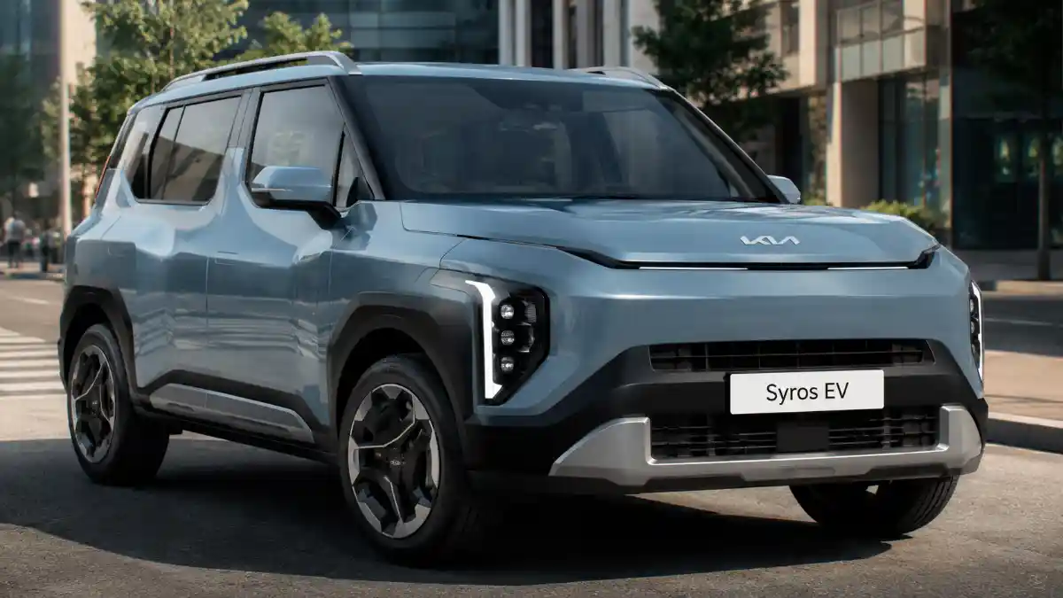 Kia Syros EV 2026 parked on a modern city street showcasing its futuristic electric SUV design, LED lighting, aerodynamic styling, and premium compact crossover appearance.